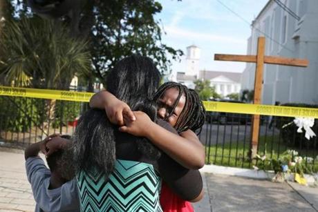 Kearston Farr comforted her daughter, Taliyah, in front of the Emanuel AME Church on Friday in Charleston, S.C.
