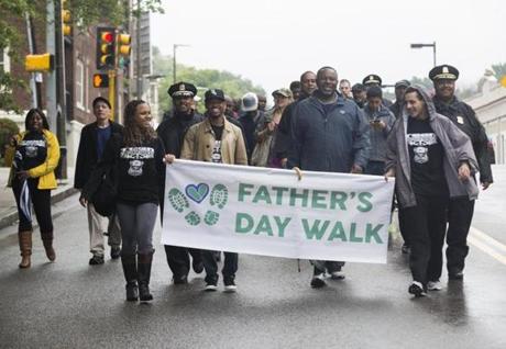 Marchers made their way from Franklin Park during a walk to celebrate Father's Day in Boston.
