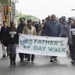 Marchers made their way from Franklin Park during a walk to celebrate Father's Day in Boston.