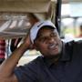 FILE - In this Nov. 11, 2011, file photo, former professional baseball player Darryl Hamilton sits in a golf cart at the Urban Youth Academy Celebrity Golf Classic, hosted by Ron Washington and Chad Gaudin, at English Turn Golf Course in New Orleans. Authorities say Hamilton was killed Sunday, June 21, 2015, in a murder-suicide in the Houston suburb of Pearland, Texas. Pearland police say an initial investigation has determined Hamilton had been shot several times and that a woman in the home died of a self-inflicted gunshot wound. The woman was identified as Monica Jordan. (Cheryl Gerber/AP Images for MLB, via AP, File)