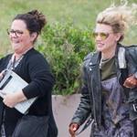Melissa McCarthy (left) and Kate McKinnon while filming a scene on the set of ?Ghostbusters? June 18 at the old Everett High School.