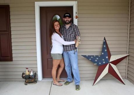 Iraq war veteran Matthew DeWitt and his wife, Cat, at their home in Hopkinton, N.H., built by Taunton nonprofit Homes for Our Troops to accommodate DeWitt.
