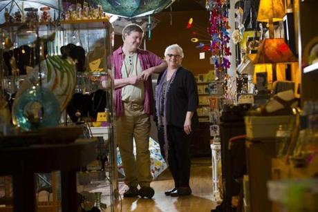 Friends Jim Donvan and Sue Thompson at Firefly Moon, the Arlington gift shop they operate.  
