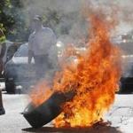 Taxi drivers on strike burned tires during a national protest against Uber.
