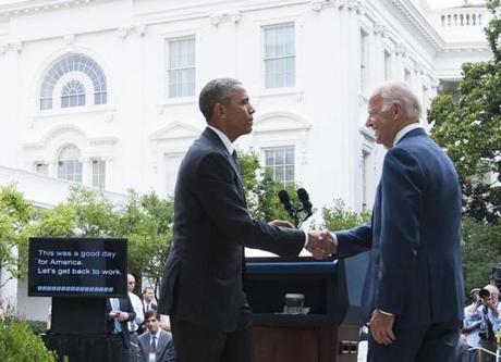 President Obama shook hands with Vice President Biden after speaking about the Supreme Court's ruling. 
