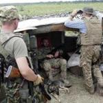 Ukrainian servicemen kept watch Thursday in the village of Krymske in the Lugansk region.