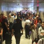 International travelers stood in long lines on Sunday, waiting to clear customs at Logan Airport.