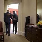 President Barack Obama and Vice President Joe Biden embrace while walking into the Oval Office, shortly before Obama was to deliver remarks on the Supreme Court?s ruling on King v. Burwell.