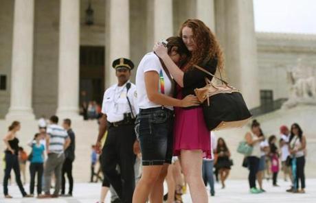 Ariel Cronig (left) and Elaine Cleary embraced outside of Supreme Court.
