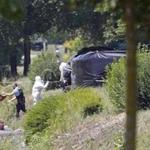 Crime scene investigators were seen at work next to a black plastic sheet outside a gas company site in Saint-Quentin-Fallavier, southeast of Lyon.