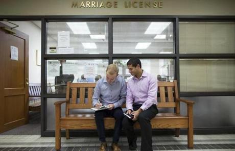Ethan Fletcher (left) and Andrew Hickam filled out marriage paperwork in Ohio.

