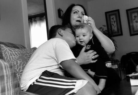 Michelle Frigon with her sons, William, 7, and Charlie, 4 months, both of whom were born drug dependent.
