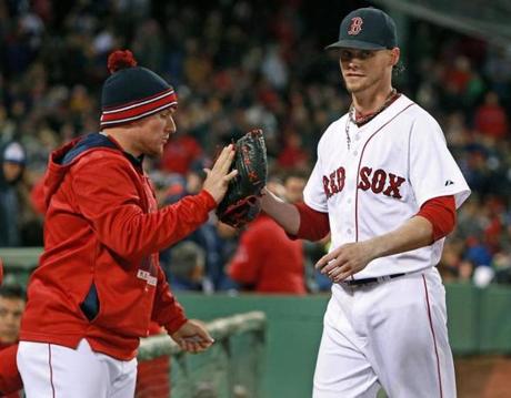 06/02/15: Boston, MA: Clay Buchholz gets a hand from injured catcher Christian Vazquez after pitching 8 shutout innings. The Boston Red Sox hosted the Minnesota Twins in a regular season MLB baseball game at Fenway Park. (Globe Staff Photo/Jim Davis) section: sports topic: Red Sox-Twins (1)
