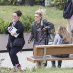 Melissa McCarthy, left, and Kate McKinnon ran while filming a scene on set of Ghostbusters at the old Everett High School.