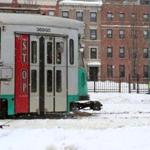 Boston, MA--2/17/2015-- An MBTA green-line car, that is not in service, prepares to go underground. The track on Commonwealth Avenue is cleared of snow, on Tuesday, February 17, 2015. Topic: 18snow Reporter: XXX