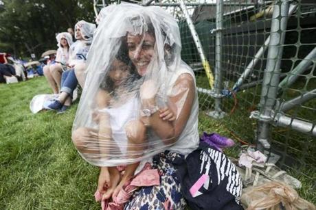 Sibel Ozcimen and her daughter Defne braced themselves for the rain.
