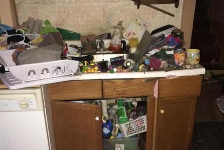 Trash was strewn around a Newburyport house condemned for ?deplorable? conditions.
