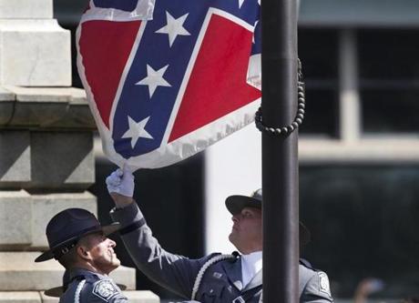 The flag was lowered by an honor guard of South Carolina troopers during a 6-minute ceremony.
