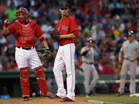 Catcher Sandy Leon signaled to the dugout that Clay Buchholz. 
