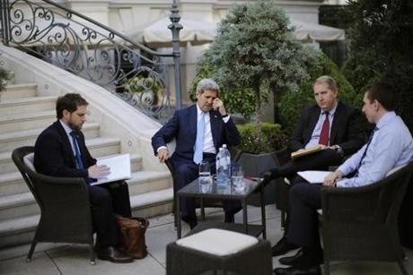 U.S. Secretary of State John Kerry, 2nd left, and State Department Chief of Staff Jon Finer, left, meet with other members of the U.S. delegation at the garden of the Palais Coburg hotel where the Iran nuclear talks meetings are being held in Vienna, Austria, Friday July 10, 2015. Kerry urged Iran to make the ?tough political decisions? needed to reach an agreement but Iranian Foreign Minister Mohammad Javad Zarif accused major powers on Friday of backtracking on previous pledges and throwing up new 