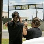 Activist Derrick Broze (left) of Houston and Mark Jankins of Round Rock monitored Camp Swift in Bastrop, Texas.