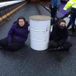 Protesters sat near a barrel on Interstate 93 in Milton in January. 