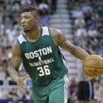 Boston Celtics' Marcus Smart brings the ball up court during the second half of an NBA summer league basketball game against the Utah Jazz Monday, July 6, 2015, in Salt Lake City. (AP Photo/Rick Bowmer) 