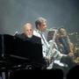 Billy Joel performing with his band at Fenway Park on Thursday.