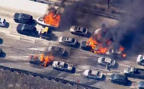 Cars burned on Interstate 15 in California on Friday. 
