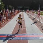 Atriathlon competitor crossed the finish line during the annual kids event at MIT on Sunday. 