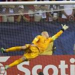 US goalkeeper Brad Guzan can?t get a hand on this goal by Jamaica in the first half.  