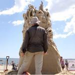 Dan Belcher, of St. Louis, MO, worked on his sculpture titled ?Venom,? during the Revere Beach International Sand Sculpting Festival in Revere on Friday.
