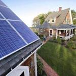 Solar panels on a garage near a house in Marshfield.