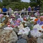 Supporters brought teddy bears and flowers to honor the girl whose remains were discovered on Deer Island.