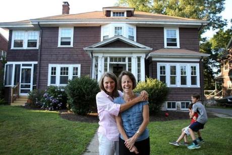 Emily Norton (above, on right) purchased her childhood home in Newton from her mother, Sally Fleschner.
