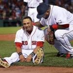 Third baseman Pablo Sandoval came to the aid of center fielder Mookie Betts, who was injured trying to make a catch in the sixth inning.