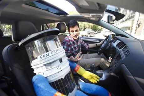 Hitchbot with Boston Globe writer Christopher Muther in July.
