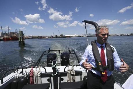 New Bedford, MA - 7/31/2015: Mayor Jon Mitchell rides on the Harbor Masters Boat in New Bedford, MA on July 31, 2015. (Harrison Hill for The Boston Globe)
