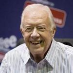 Former president Jimmy Carter posed for photographs at an event for his new book in July. 