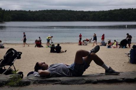 Edward Wagner relaxed at Walden Pond, where parking fees have gone up to $8 from $5.
