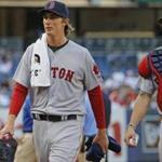 Boston Red Sox starting pitcher Henry Owens, left, walks in from the bullpen after warming up before his first Major League appearance in a baseball game against the New York Yankees at Yankee Stadium in New York, Tuesday, Aug. 4, 2015. (AP Photo/Kathy Willens)