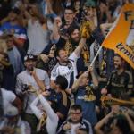 Fans react during an LA Galaxy-New England Revolution match. 