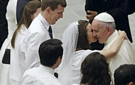 Pope Francis greeted newlyweds during the general audience in the Paul VI hall at the Vatican Aug. 5, 2015. Francis said divorced Catholics who remarry and their children deserve better treatment from the Catholic Church. 

