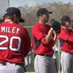 Fort Myers, FL - 02/23/15 - Boston Red Sox pitchers from l to r: Wade Miley, Rick Porcello, Clay Buchholz, and Eduardo Rodriguez, prepare to throw their scheduled bullpen sessions. Red Sox Spring Training. (Barry Chin/Globe Staff), Section: Sports, Reporter: Peter Abraham, Topic: 24Red Sox, LOID: 8.0.2717390732. 