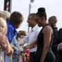 President Barack Obama and Michelle Obama greeted well-wishers upon arrival on Martha's Vineyard on Friday.