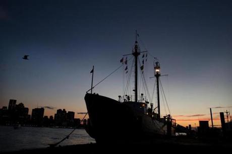 The beacon of the Nantucket Lightship LV-112 shone brightly Friday night during a landmark event at the Boston Harbor Shipyard and Marina. 
