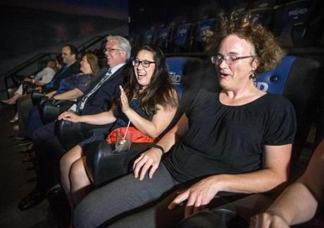 Kathleen Boyd (right) and Kristin Livingston reacted to water mist in the MX4D theater at Showcase Cinema de Lux.
