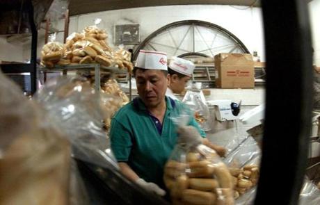 Workers bagged rolls at Quinzani's Bakery on Harrison Avenue in 2003.
