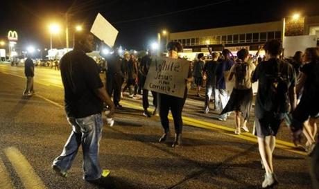 Crowds gathered on a street in Ferguson, Mo., Monday night.
