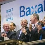 Ludwig Hantson (center), CEO of Baxalta, celebrated the company?s IPO after ringing the opening bell above the floor of the New York Stock Exchance in July. 